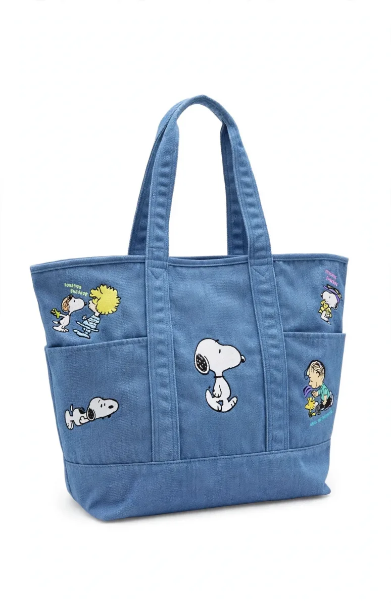 Peanuts Snoopy blue denim tote bag with character pockets featuring Snoopy, Woodstock, Charlie Brown, Linus and Lucy