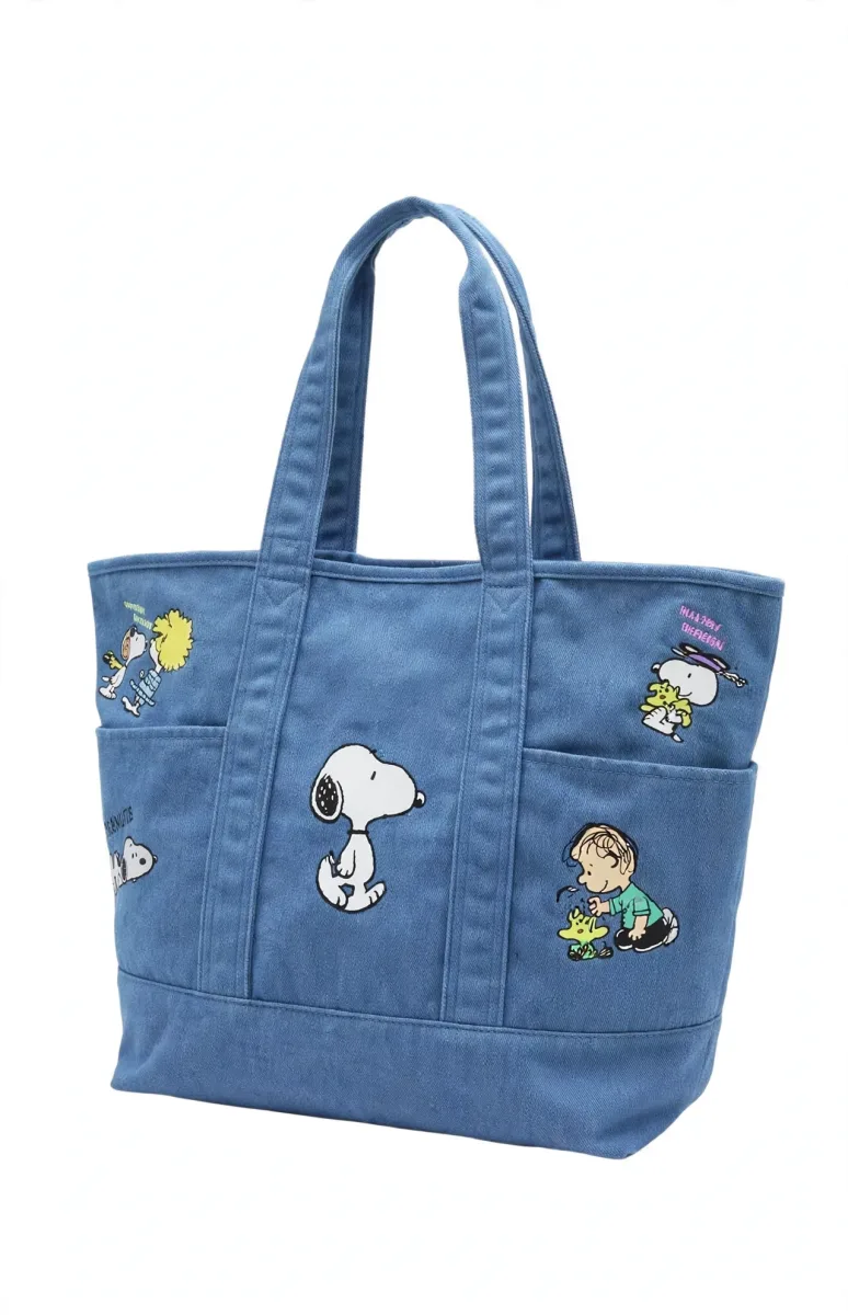 Peanuts Snoopy blue denim tote bag with character pockets featuring Snoopy, Woodstock, Charlie Brown, Linus and Lucy
