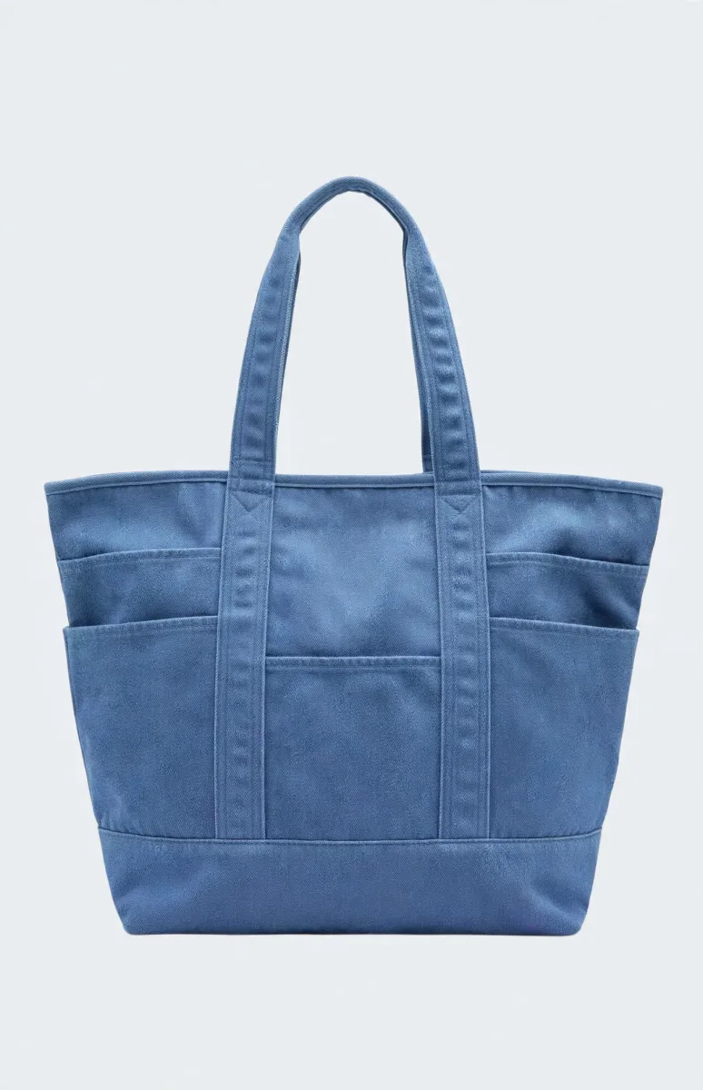 Peanuts Snoopy blue denim tote bag with character pockets featuring Snoopy, Woodstock, Charlie Brown, Linus and Lucy